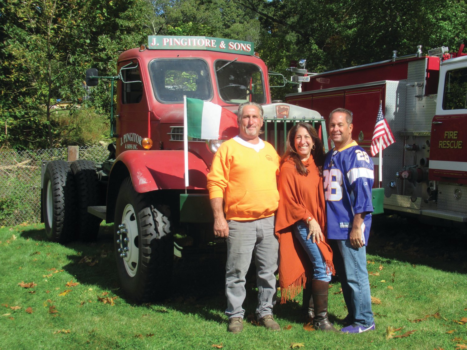 PREXY’S PALS: The Pingitores — siblings Joe, Fran, and Dave — enjoy Sunday’s sparkling sun in front of the family owned 1942 Chain-Driven Sterling which was among the more than 60 vintage vehicles on display during Sunday’s Ocean State Vintage Haulers Fall Round-up at Ron Rossi’s Christmas Tree Farm in Cranston.